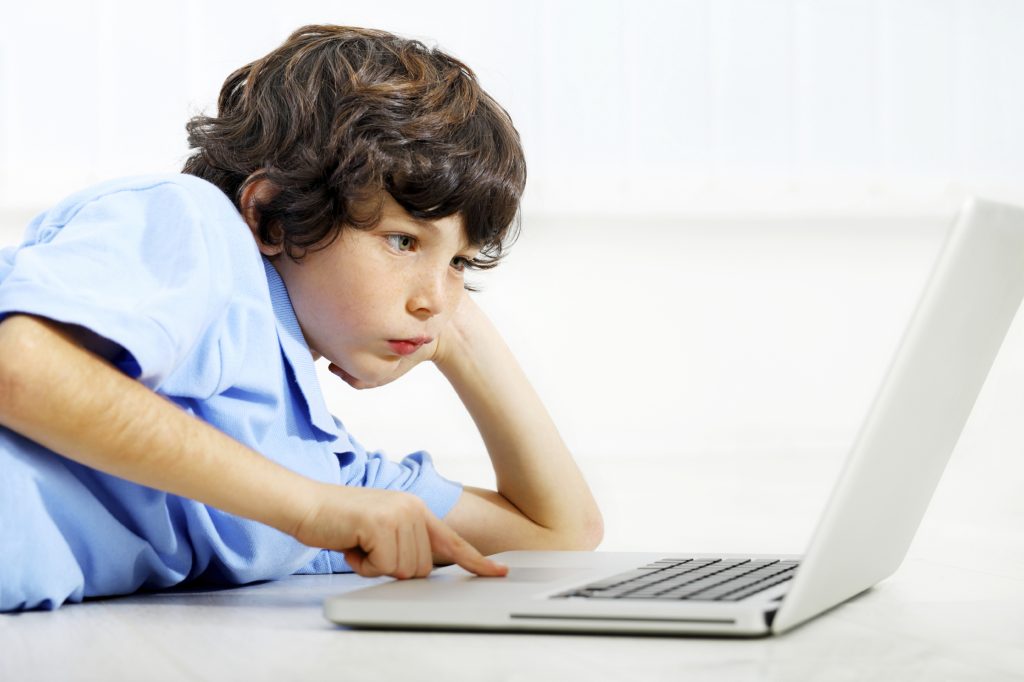 Portrait Of A Boy Using Laptop.