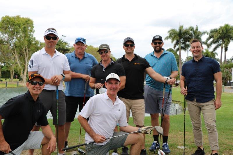 8 golfers smiling to camera
