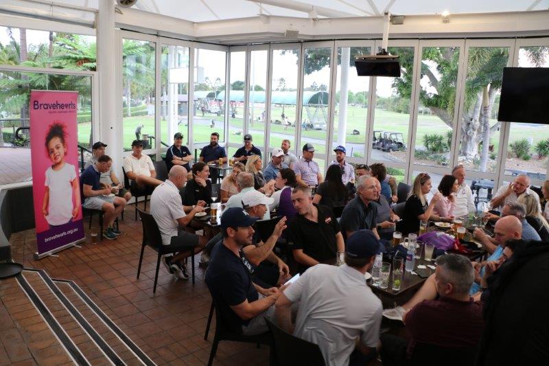 Golfers enjoying lunch in clubhouse