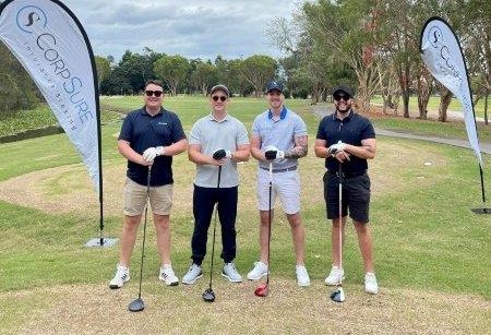 Photo of 4 golfers at CorpSure hole