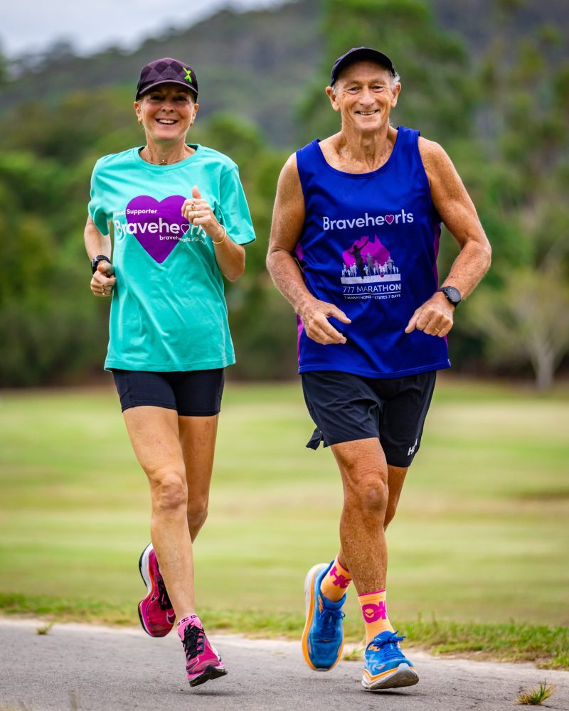 777 marathon runners running and smiling