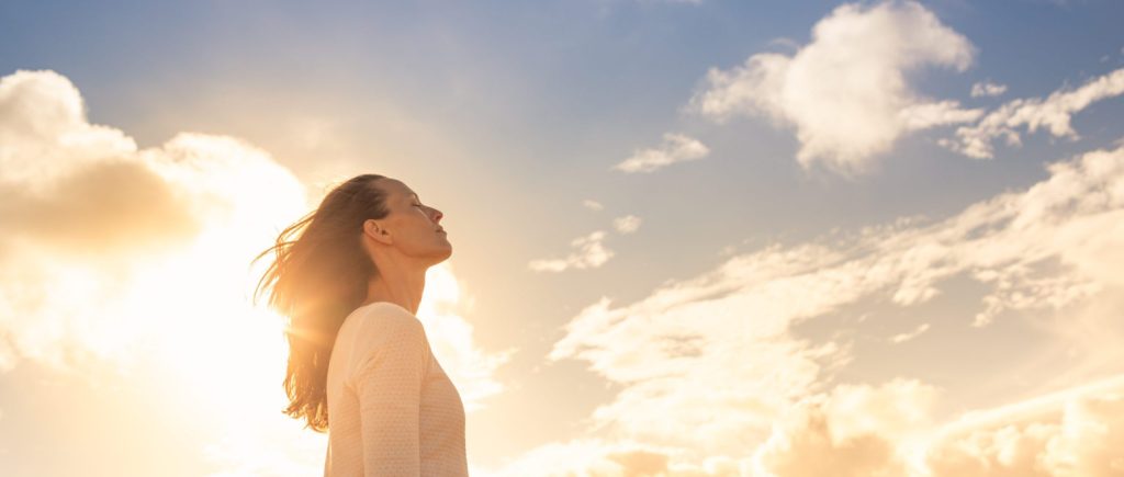 Woman Looking Up Into The Sky And Thinking About Her Future.